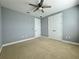 Bedroom with double doors and ceiling fan at 3404 79Th Street W Cir # 203, Bradenton, FL 34209