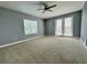 Bright and airy bedroom with neutral walls, carpet flooring, and access to a balcony at 3404 79Th Street W Cir # 203, Bradenton, FL 34209