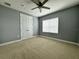 Spacious bedroom with window, ceiling fan and carpet at 3404 79Th Street W Cir # 203, Bradenton, FL 34209