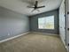 Spacious bedroom with carpeted floor and ceiling fan at 3404 79Th Street W Cir # 203, Bradenton, FL 34209
