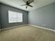 Bedroom with window, ceiling fan, and neutral walls at 3404 79Th Street W Cir # 203, Bradenton, FL 34209
