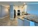 Modern kitchen with white cabinets, granite countertops, and stainless steel appliances at 3404 79Th Street W Cir # 203, Bradenton, FL 34209