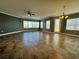 Spacious living room with tile floors, large windows and balcony access at 3404 79Th Street W Cir # 203, Bradenton, FL 34209