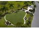 Community putting green surrounded by lush landscaping at 3404 79Th Street W Cir # 203, Bradenton, FL 34209