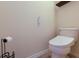 Modern toilet and wall-mounted toilet paper holder at 3618 Summerwind Cir, Bradenton, FL 34209