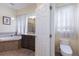 Bathroom features a toilet and updated vanity at 3618 Summerwind Cir, Bradenton, FL 34209