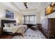 Spacious main bedroom with large bed, sitting area, and ample natural light at 3618 Summerwind Cir, Bradenton, FL 34209