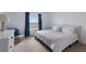 Bright bedroom with a king-size bed and sitting chair at 3618 Summerwind Cir, Bradenton, FL 34209