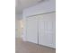 Large bedroom closet with double doors and built in shelves at 3618 Summerwind Cir, Bradenton, FL 34209