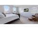 Main bedroom with a comfortable chair and large window at 3618 Summerwind Cir, Bradenton, FL 34209