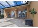 Spacious covered patio with pavers, pool view, and grilling area at 3618 Summerwind Cir, Bradenton, FL 34209