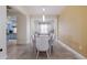 Elegant dining room with a large table and access to kitchen at 3618 Summerwind Cir, Bradenton, FL 34209