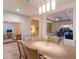 Bright dining room features a large table, chairs, and a view into the living room at 3618 Summerwind Cir, Bradenton, FL 34209