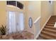 Spacious entryway with staircase and natural light at 3618 Summerwind Cir, Bradenton, FL 34209