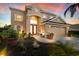 Two-story house with landscaped yard, at dusk at 3618 Summerwind Cir, Bradenton, FL 34209