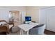 Home office features a workspace, built-in shelving and hardwood floors at 3618 Summerwind Cir, Bradenton, FL 34209