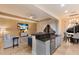 Modern kitchen with gray cabinets, granite counters, and breakfast bar at 3618 Summerwind Cir, Bradenton, FL 34209