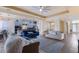 Open living room with blue sofa and view into the kitchen at 3618 Summerwind Cir, Bradenton, FL 34209
