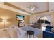 Living room boasts comfortable seating and a large TV, with pool view at 3618 Summerwind Cir, Bradenton, FL 34209