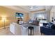 Relaxing living room with two sofas, large TV and pool access at 3618 Summerwind Cir, Bradenton, FL 34209