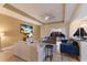 Relaxing living room with comfy sofas, large TV, and view of pool at 3618 Summerwind Cir, Bradenton, FL 34209
