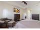Main bedroom with large bed, TV, and wood dresser at 3618 Summerwind Cir, Bradenton, FL 34209