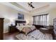 Relaxing main bedroom with king bed, hardwood floors, and sitting area at 3618 Summerwind Cir, Bradenton, FL 34209
