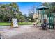 Community playground with climbing wall and slide at 3618 Summerwind Cir, Bradenton, FL 34209