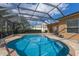 Relaxing screened pool with patio and lush landscape at 3618 Summerwind Cir, Bradenton, FL 34209
