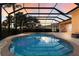 Relaxing screened pool and spa at sunset at 3618 Summerwind Cir, Bradenton, FL 34209