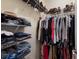 A well-organized walk-in closet with hanging space and shelving at 3618 Summerwind Cir, Bradenton, FL 34209