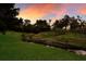 Peaceful waterfront view with tranquil stream and lush greenery at 3618 Summerwind Cir, Bradenton, FL 34209
