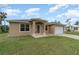 Two-story house with tan exterior and double-door entry at 367 Skyland Ln, Port Charlotte, FL 33953