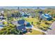 Waterfront property showcasing a single-story home with lush landscaping at 3808 El Conquistador Pkwy, Bradenton, FL 34210