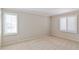 Bright bedroom with neutral walls, carpet, and window shutters at 3808 El Conquistador Pkwy, Bradenton, FL 34210