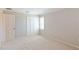 Spacious bedroom featuring carpet, double closet, and window shutters at 3808 El Conquistador Pkwy, Bradenton, FL 34210