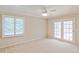 Spacious bedroom with double doors leading to a patio at 3808 El Conquistador Pkwy, Bradenton, FL 34210
