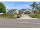 House with a large driveway and manicured lawn at 3808 El Conquistador Pkwy, Bradenton, FL 34210