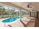 Relaxing pool area with brick patio and screened enclosure at 3808 El Conquistador Pkwy, Bradenton, FL 34210