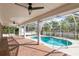 Inviting pool area with brick patio and screened enclosure at 3808 El Conquistador Pkwy, Bradenton, FL 34210