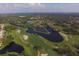 Community view with golf course and lakes at 3911 Torrey Pines Blvd, Sarasota, FL 34238