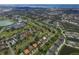 Aerial view of community with golf course and houses at 3911 Torrey Pines Blvd, Sarasota, FL 34238