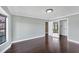 Well-lit bedroom featuring dark hardwood floors and a walk-in closet at 3911 Torrey Pines Blvd, Sarasota, FL 34238