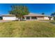 Single story home with a large front yard at 3911 Torrey Pines Blvd, Sarasota, FL 34238