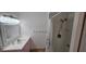 Bathroom features updated vanity, mirror, and shower with modern fixtures at 3935 Panola Ln # 183, Sarasota, FL 34232