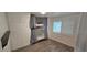 Bedroom featuring a built-in bunk bed, wood-look floors, white walls and plantation shutters at 3935 Panola Ln # 183, Sarasota, FL 34232
