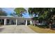 Front view of home with carport and American flag at 3935 Panola Ln # 183, Sarasota, FL 34232