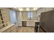 Updated kitchen with stainless steel appliances, modern countertops, and ample cabinet space at 3935 Panola Ln # 183, Sarasota, FL 34232
