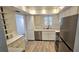 Updated kitchen with stainless steel appliances, modern countertops, and ample cabinet space at 3935 Panola Ln # 183, Sarasota, FL 34232