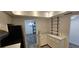 Cozy kitchen features white cabinetry, modern countertops, and an adjacent dining area at 3935 Panola Ln # 183, Sarasota, FL 34232